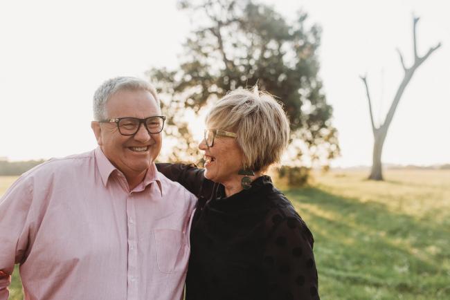Woman smiling at man during Perth family photography session at Perry's Paddock during golden hour