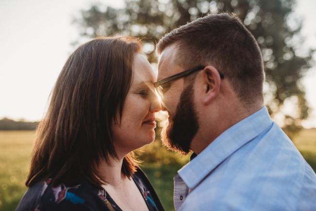 Man and woman nose to nose during Perth family photography session at Perry's Paddock during golden hour