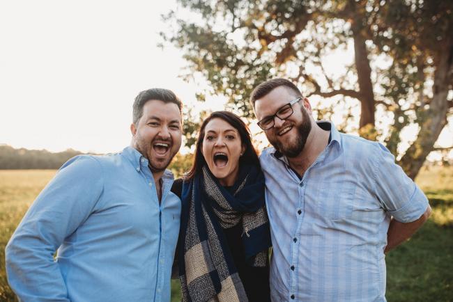 Sister and brothers laughing during Perth family photography session at Perry's Paddock during golden hour
