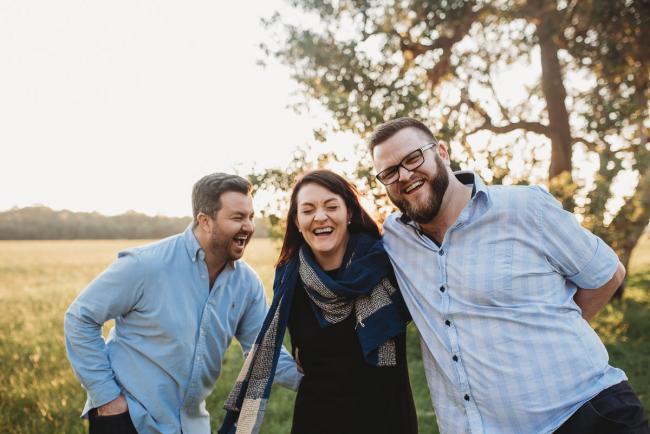 Brothers and sister laughing during Perth family photography session at Perry's Paddock during golden hour