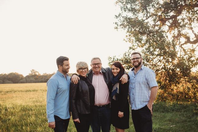 Parents with their older children during Perth family photography session at Perry's Paddock during golden hour