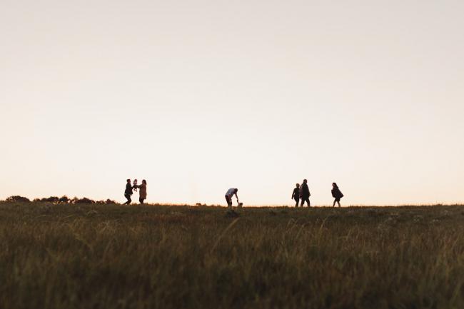 Silhouette of extended family during Perth family photography session at Perry's Paddock during golden hour