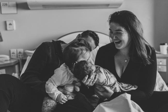 Newborn-and-Fresh-48-Photographer-Perth-SJOG-Mt-Lawley-3-of-51 Black and white image of toddler kissing baby sister with Perth Fresh 48 photographer at SJOG Mt Lawley