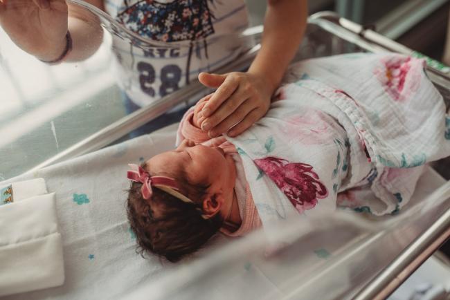 Newborn-and-Fresh-48-Photographer-Perth-SJOG-Mt-Lawley-47-of-51 Big sister's hand on baby sister in bassinet with Perth Fresh 48 photographer at SJOG Mt Lawley