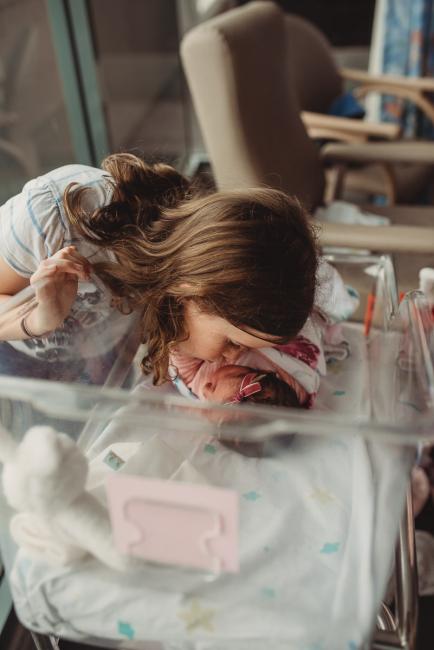Newborn-and-Fresh-48-Photographer-Perth-SJOG-Mt-Lawley-48-of-51 Big sister leaning in to bassinet of baby sister with Perth Fresh 48 photographer at SJOG Mt Lawley