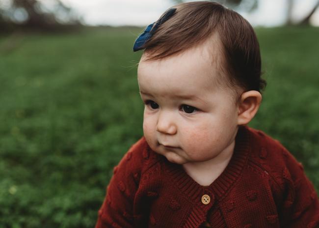 Close up of little girl's face with Perth family photographer at Perry's Paddock