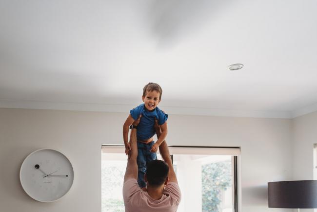 Perth-Newborn-Photographer-2-of-60 Father lifting son in the air with Perth lifestyle family photographer