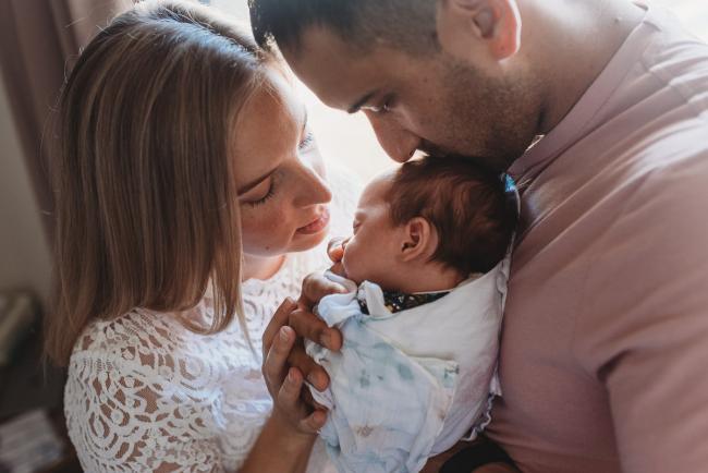 Perth-Newborn-Photographer-24-of-60-1 Parents kissing new baby with Perth newborn lifestyle photographer