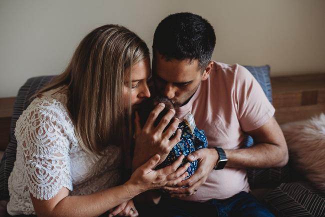 Perth-Newborn-Photographer-27-of-60 Parents kissing newborns head with Perth newborn lifestyle photographer