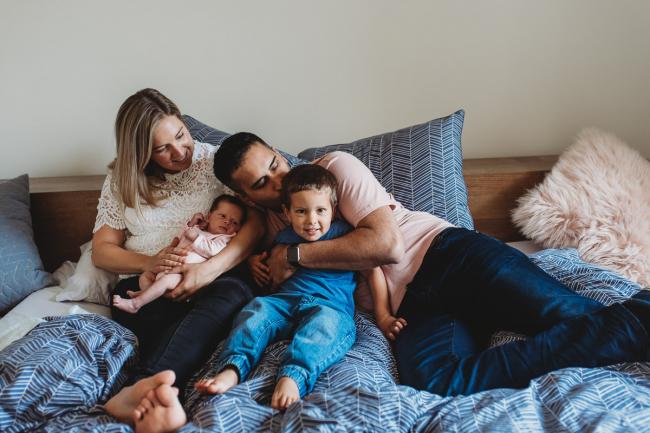 Perth-Newborn-Photographer-30-of-60 Mother father, son and newborn baby on a bed with Perth newborn lifestyle photographer