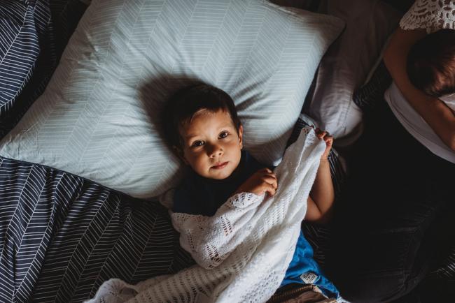 Perth-Newborn-Photographer-43-of-60 Little boy on bed with Perth lifestyle family photographer