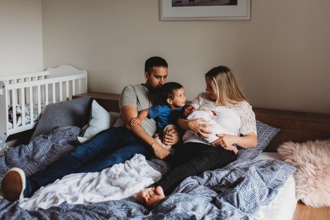 Perth-Newborn-Photographer-44-of-60 Family of four on the bed with Lifestyle Newborn Photographer Perth