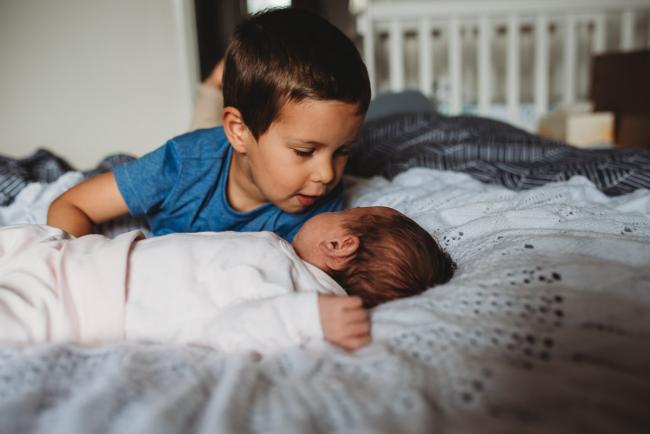 Perth-Newborn-Photographer-52-of-60 Little boy laying next to his baby sister with Perth newborn lifestyle photographer