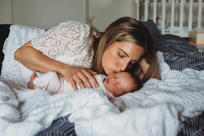 Perth-Newborn-Photographer-55-of-60 Mother kissing newborn baby with Perth newborn lifestyle photographer