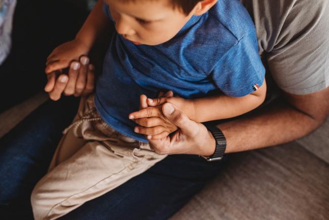 Perth-Newborn-Photographer-60-of-60 Father holding son's hands with Perth lifestyle family photographer