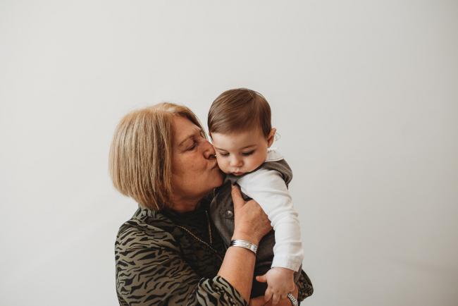 Grandmother kissing grandson with Perth Events Photographer
