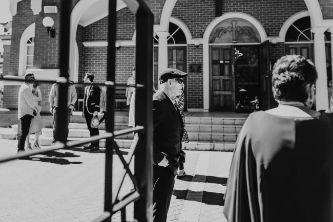 Black and white image looking through the gate of the church with Perth Events Photographer