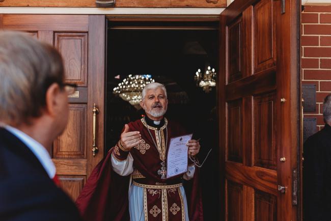 Priest standing in the door of the church at Macedonian Orthodox Church with Perth Events Photographer