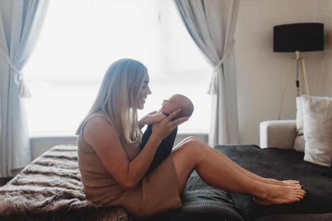 Lifestyle-Newborn-Photographer-Perth-60-of-69 Mother holding newborn baby in front of her with Perth lifestyle newborn photographer