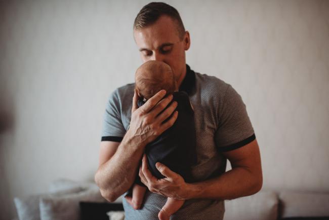 Lifestyle-Newborn-Photographer-Perth-64-of-69 Father holding newborn baby to his chest with Perth lifestyle newborn photographer