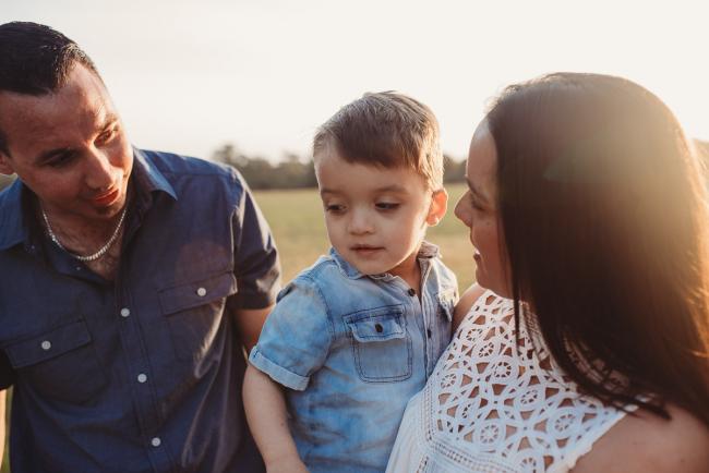 Parents looking at son during Perth family photographer session at Perry's Paddock