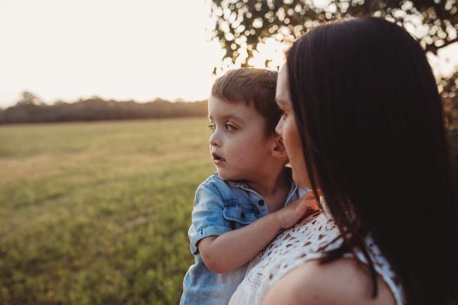 Mother holding son during Perth family photographer session at Perry's Paddock