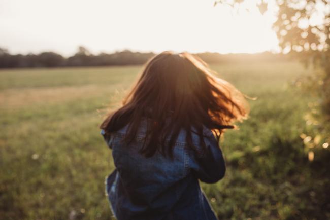 Little girl spinning during Perth family photographer session at Perry's Paddock