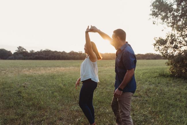Couple dancing during Perth family photographer session at Perry's Paddock