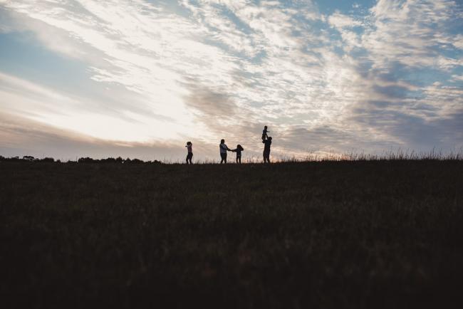 Silhouette image of family during Perth family photographer session at Perry's Paddock