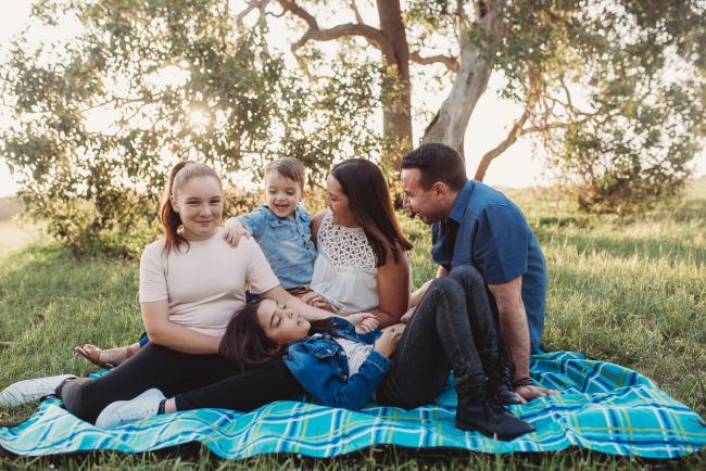 Family on a rug during Perth family photographer session at Perry's Paddock