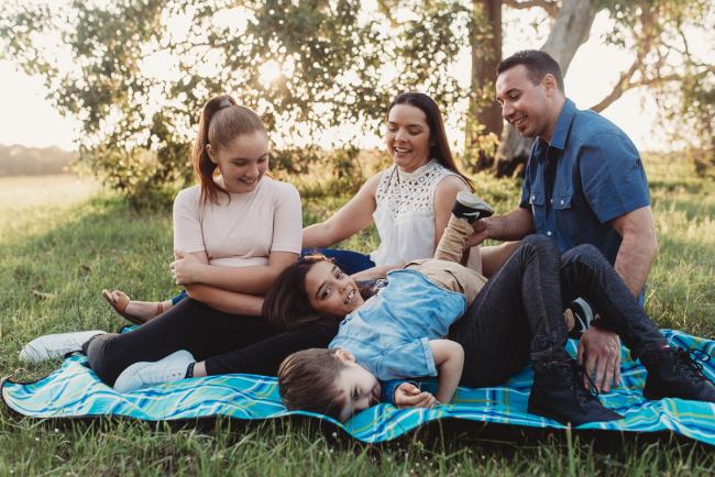 Family on a rug during Perth family photographer session at Perry's Paddock