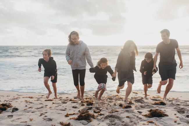 Family-Photographer-Perth-Burns-Beach-11-of-57 Family of 6 holding hands and running away from water at Burns Beach with Perth Family Photographer