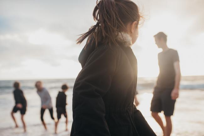 Family-Photographer-Perth-Burns-Beach-13-of-57 Little girl turning back to her family at Burns Beach with Perth Family Photographer