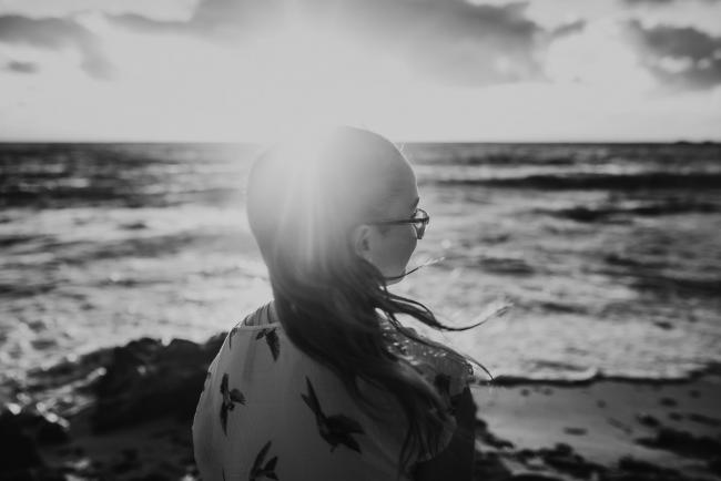 Family-Photographer-Perth-Burns-Beach-22-of-57 Black and white image of girls hair in the wind at Burns Beach with Perth Family Photographer