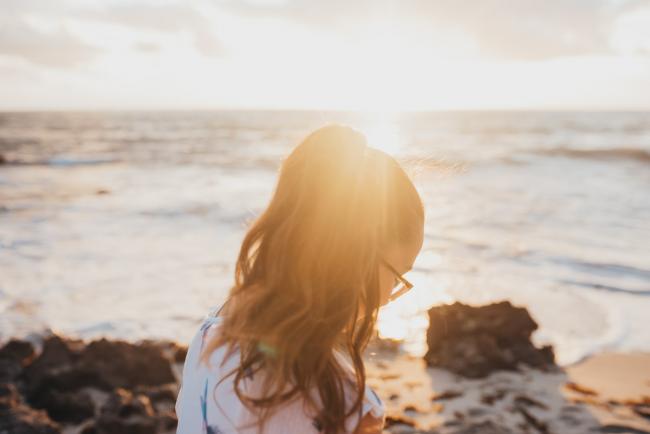 Family-Photographer-Perth-Burns-Beach-23-of-57 Sunlight poking through girls hair at Burns Beach with Perth Family Photographer