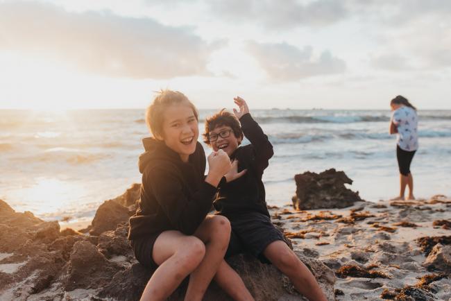 Brothers playing at Burns Beach with Perth Family Photographer