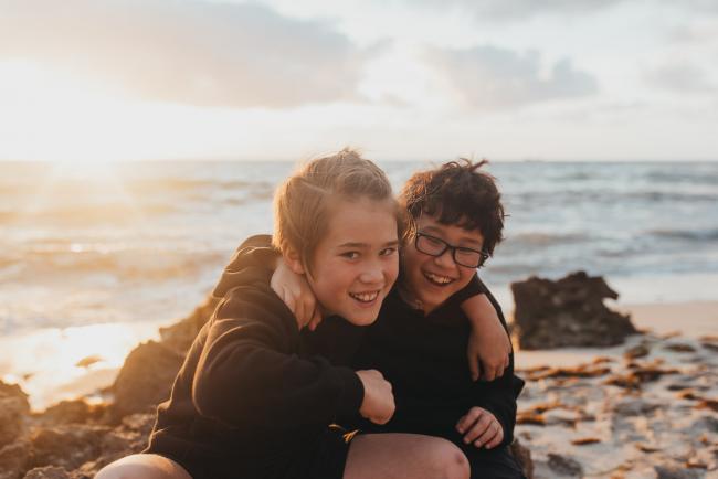Family-Photographer-Perth-Burns-Beach-28-of-57 Brothers with arms around each other at Burns Beach with Perth Family Photographer