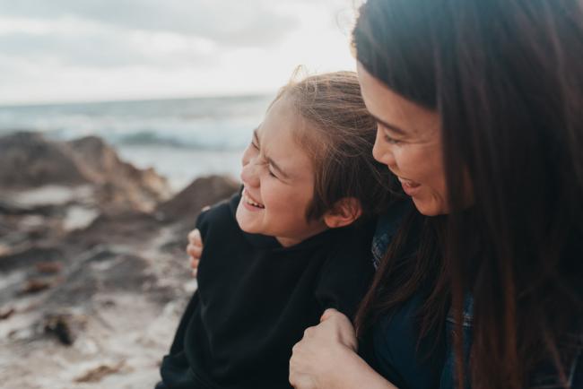 mother and son laughing at Burns Beach with Perth Family Photographer