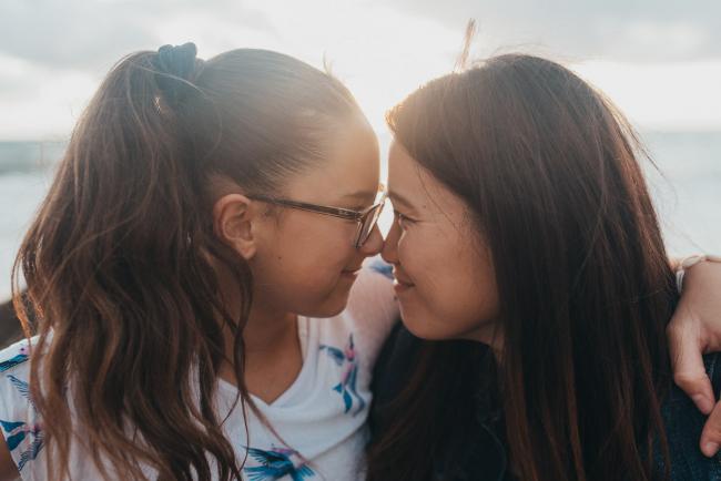 Family-Photographer-Perth-Burns-Beach-42-of-57 Mother and daughter touching foreheads at Burns Beach with Perth Family Photographer