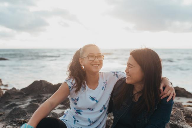 Mother and daughter laughing at Burns Beach with Perth Family Photographer
