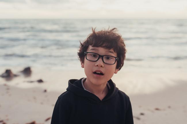 Family-Photographer-Perth-Burns-Beach-53-of-57 Boy with glasses at Burns Beach with Perth Family Photographer