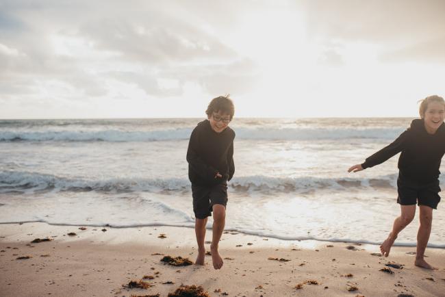Family-Photographer-Perth-Burns-Beach-9-of-57 Brothers running away from water at Burns Beach with Perth Family Photographer
