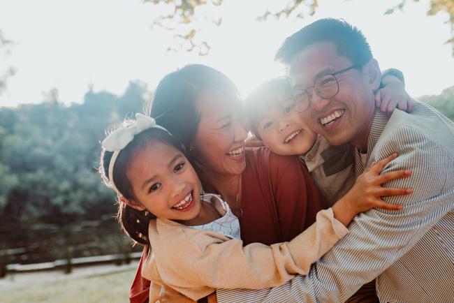 Family-Photographer-Perth-Hyde-Park-11-of-54 Family of four cuddling and smiling during Perth extended family session at Hyde Park with Perth family photographer