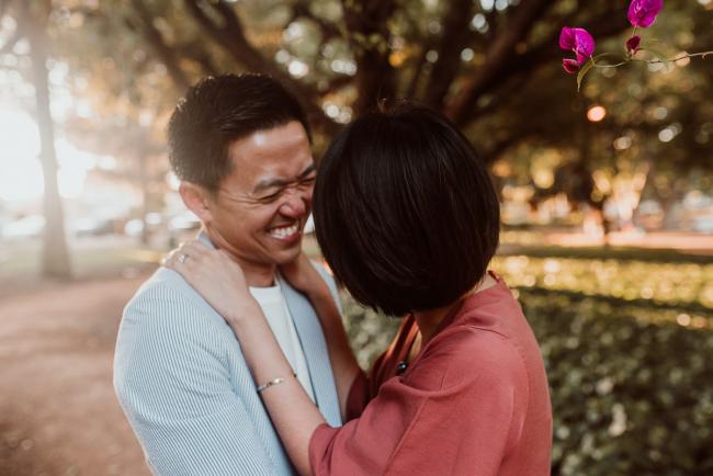 Family-Photographer-Perth-Hyde-Park-24-of-54 Couple laughing at each other during Perth extended family session at Hyde Park with Perth family photographer