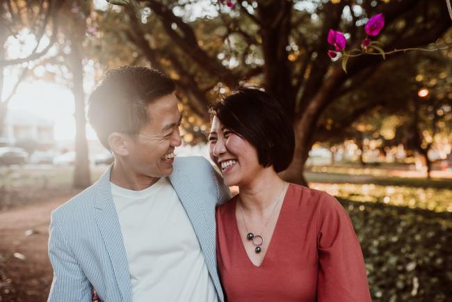 Family-Photographer-Perth-Hyde-Park-25-of-54 Couple looking at each other and smiling during Perth extended family session at Hyde Park with Perth family photographer