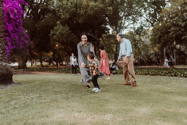 Family-Photographer-Perth-Hyde-Park-45-of-54 Mother chasing son during Perth extended family session at Hyde Park with Perth family photographer
