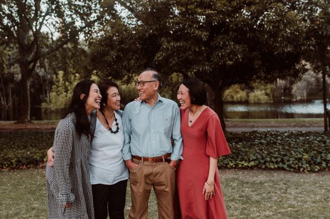 Family-Photographer-Perth-Hyde-Park-49-of-54 Parents with their grown up daughters during Perth extended family session at Hyde Park with Perth family photographer