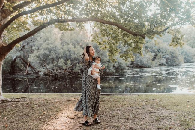 Family-Photographer-Perth-Hyde-Park-6-of-54 Mother holding daughter and playing with her hair during Perth extended family session at Hyde Park with Perth family photographer