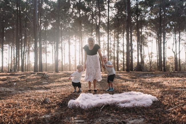 Family-Photographer-Perth-The-Pines-13-of-29 Mother holding hands with two sons during Perth family photography session at The Pines Wanneroo