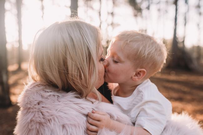 Family-Photographer-Perth-The-Pines-21-of-29 Mother and son kissing during Perth family photography session at The Pines Wanneroo